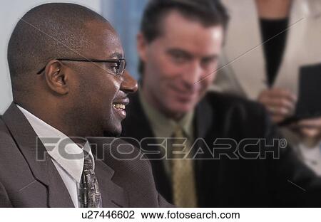 Stock Image - Laughing meeting. Fotosearch