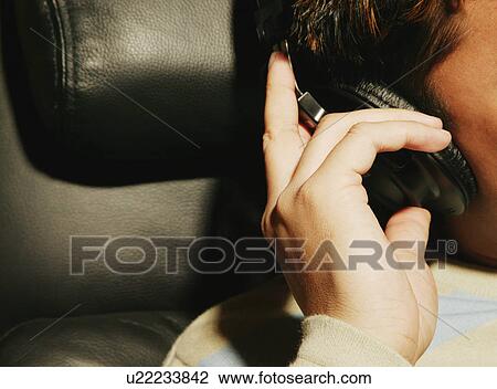 Stock Image - Listening to music on headphones. Fotosearch