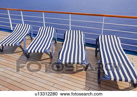 Stock Image - Lounging chairs in a row. Fotosearch