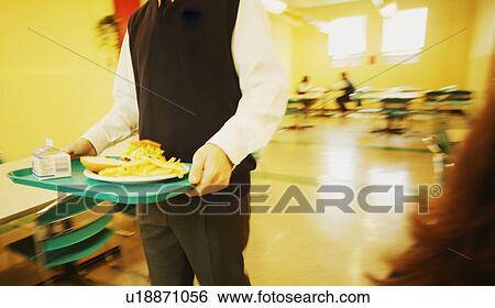 Stock Photograph - Lunch in the school cafeteria. Fotosearch