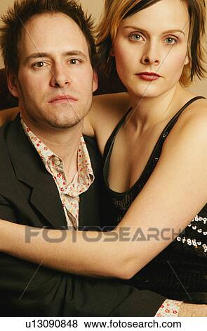 Stock Photo - Man and woman embrace. Fotosearch