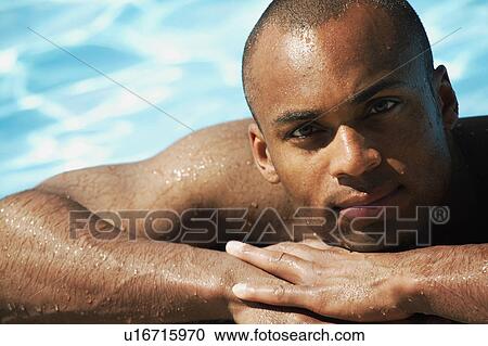 Stock Image - Man in swimming pool. Fotosearch