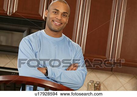Picture - Man in the kitchen. Fotosearch