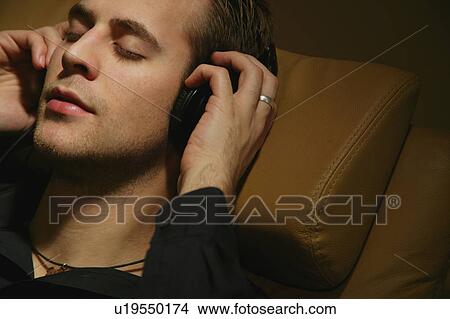 Picture - Man listens to music. Fotosearch