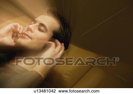Man listens to music View Large Photo Image Stock Image - Man listens to music. Fotosearch