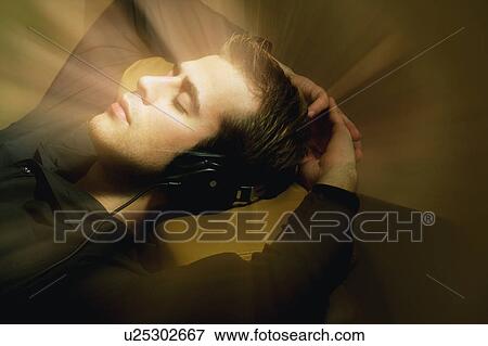 Man listens to music View Large Photo Image Stock Photo - Man listens to music. Fotosearch