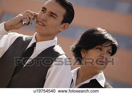 Stock Image - Man on cell phone. Fotosearch