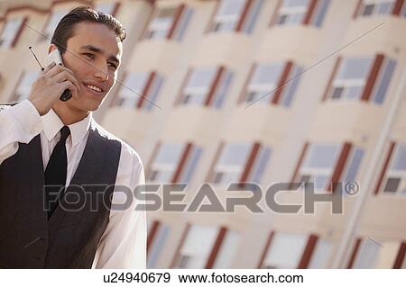 Man on cell phone View Large Photo Image Stock Photo - Man on cell phone. Fotosearch