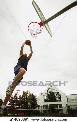 Man playing basketball View Large Photo Image Stock Image - Man playing basketball. Fotosearch
