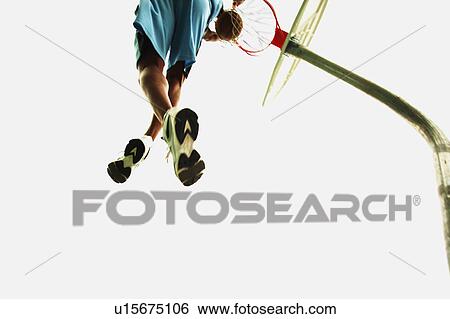 Stock Photograph - Man playing basketball. Fotosearch