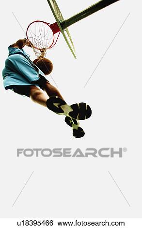 Stock Photograph - Man playing basketball. Fotosearch