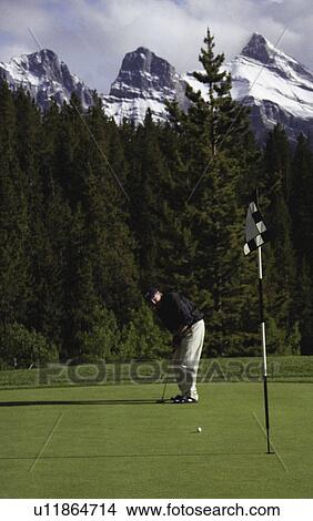 Picture - Man playing golf. Fotosearch