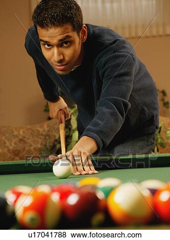 Man playing pool View Large Photo Image Stock Photo - Man playing pool. Fotosearch