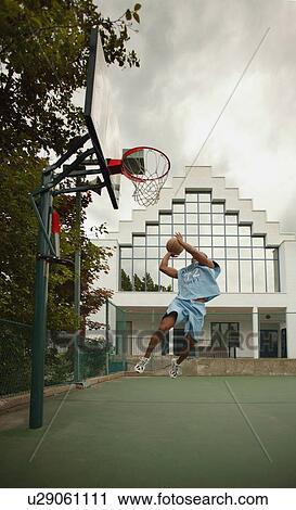 Man plays basketball View Large Photo Image Stock Image - Man plays basketball. Fotosearch