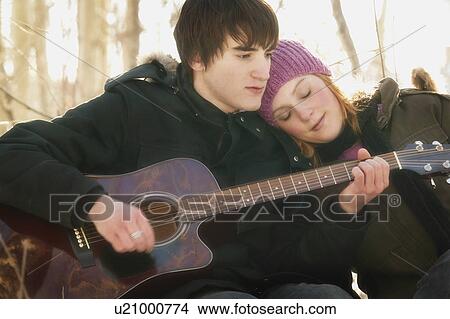 Man plays guitar View Large Photo Image Picture - Man plays guitar. Fotosearch