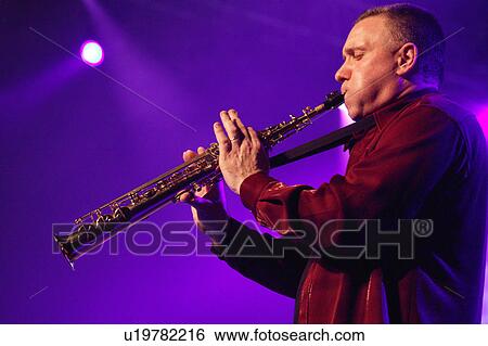 Stock Photograph - Man plays saxophone. Fotosearch