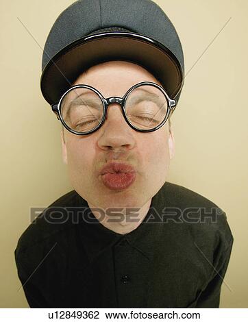 Stock Image - Man puckers up. Fotosearch