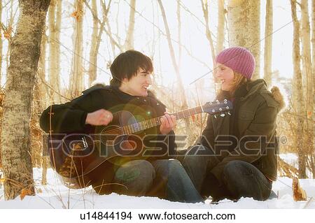 Man serenades woman View Large Photo Image Picture - Man serenades woman. Fotosearch