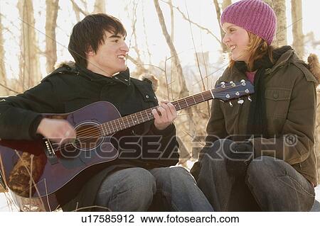 Man serenades woman View Large Photo Image Stock Image - Man serenades woman. Fotosearch
