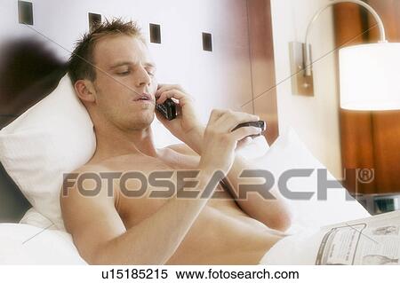 Man sitting up in bed View Large Photo Image Stock Photography - Man sitting up in bed. Fotosearch