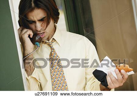 Man talking on the phone View Large Photo Image Stock Photo - Man talking on the phone. Fotosearch