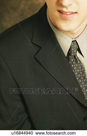 Man wearing fashionable suit View Large Photo Image Stock Image - Man wearing fashionable suit. Fotosearch