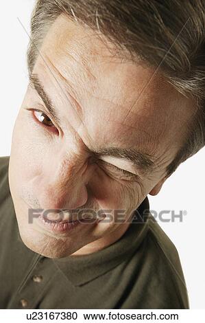 Stock Image - Man winks. Fotosearch
