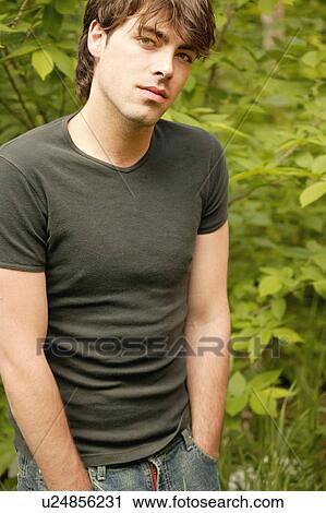 Man with black t-shirt View Large Photo Image Stock Image - Man with black t-shirt. Fotosearch