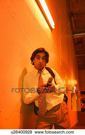 Stock Photo - Man with cell phone. Fotosearch