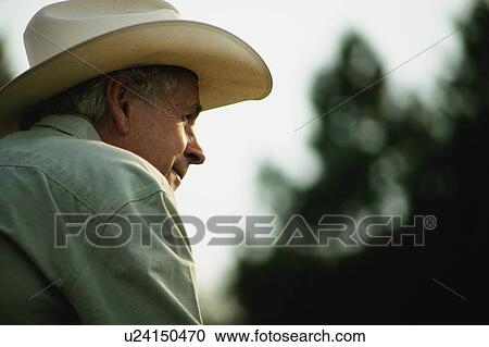 Man with cowboy hat View Large Photo Image Stock Image - Man with cowboy hat. Fotosearch