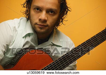 Man with his guitar View Large Photo Image Stock Photo - Man with his guitar. Fotosearch