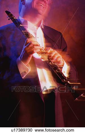 Stock Image - Man with soprano saxophone. Fotosearch