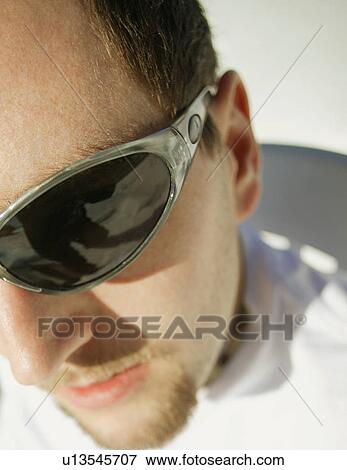 Stock Photo - Man with sunglasses. Fotosearch