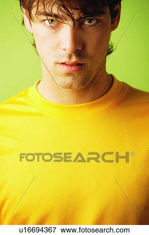 Stock Photo - Man with yellow shirt. Fotosearch