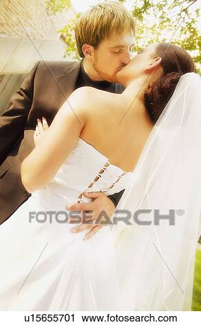 Stock Image - Married couple kiss. Fotosearch