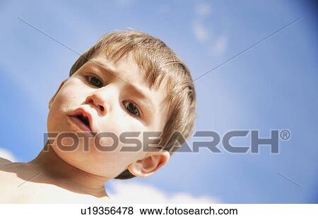 Stock Photo - Mischievous boy. Fotosearch