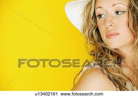 Model looking over her shoulder View Large Photo Image Stock Image - Model looking over her shoulder. Fotosearch