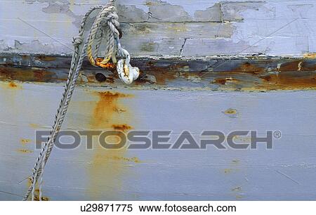 Stock Photography - Mooring tackle and ropes on wooden boat. Fotosearch