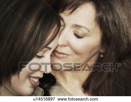 Stock Photo - Mother and daughter share a special moment. Fotosearch