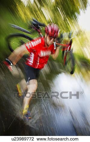 Stock Image - Mountain biker. Fotosearch