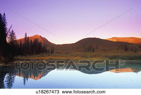 Stock Image - Mountain lake with reflection. Fotosearch