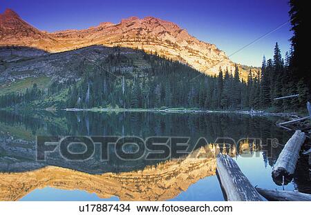 Mountain lake with reflections View Large Photo Image Picture - Mountain lake with reflections. Fotosearch