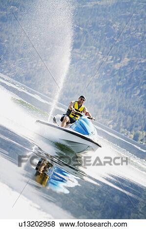 Stock Photo - On a sea-doo. Fotosearch