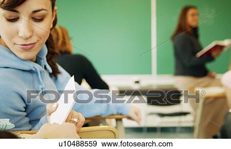 Passing a note View Large Photo Image Stock Photo - Passing a note. Fotosearch