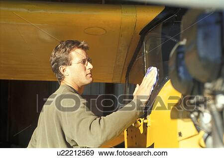 Pilot with his airplane View Large Photo Image Stock Photo - Pilot with his airplane. Fotosearch