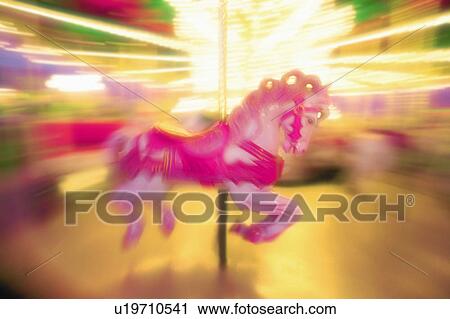 Stock Image - Pink carousel horse. Fotosearch