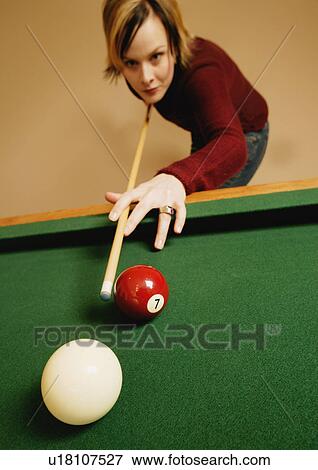 Stock Photo - Playing a game of pool. Fotosearch
