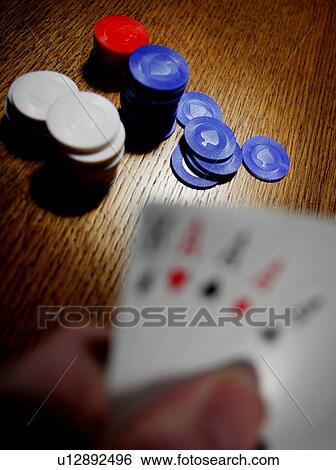 Stock Photograph - Playing poker. Fotosearch