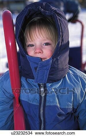 Picture - Portrait of a child in the cold. Fotosearch