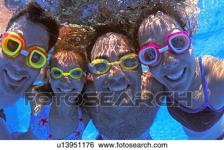 Stock Photograph - Portrait of a happy underwater group. Fotosearch